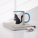 Black_Cat_Holding_Coffee_Mug_11oz_Ceram_Lifestyle_Notebook_Mockup.png