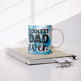 Coolest_Dad_Ever_11oz_Coffee_Mug_White_o_Lifestyle_Notebook_Mockup.png_15615633