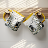 Cute_Ghost_and_Black_Cat_in_Field_of_Dai_Hanging_Mugs_Mockup.png