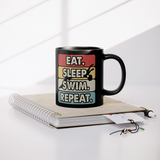 Eat_Sleep_Swim_Repeat_11oz_Ceramic_Bl_Lifestyle_Notebook_Mockup.png_15683550