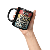 Eat_Sleep_Swim_Repeat_11oz_Ceramic_Bl_Lifestyle_Raised_Hand_LH_Mockup.png_15683552