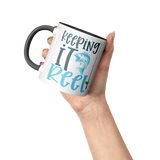 Keeping_it_Reel_11oz_Fishing_Coffee_Mugm_Accent_Mug_Raised_Hand_LH_Mockup.png_15616122