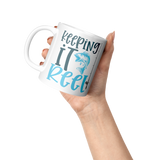 Keeping_it_Reel_11oz_Fishing_Coffee_Mugm_Lifestyle_Raised_Hand_LH_Mockup.png_15616112