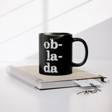 Ob_La_Di_Ob_La_Da_11_oz_Black_Coffee_Mug_Lifestyle_Notebook_Mockup.png_15559207