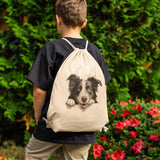 Peeking Border Collie Drawstring Canvas Backpack