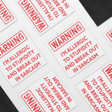WARNING_I_Am_Allergic_to_Stupidity_Car__SquareCarMagnet_Scattered_Mockup.png